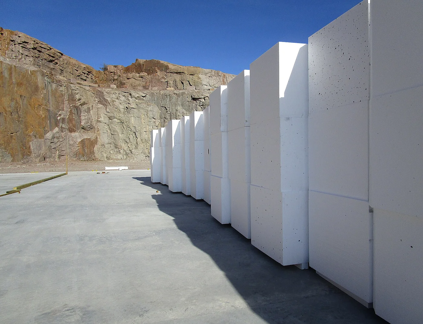 Cut EPS panel stack — scrap and offcuts route to crusher
